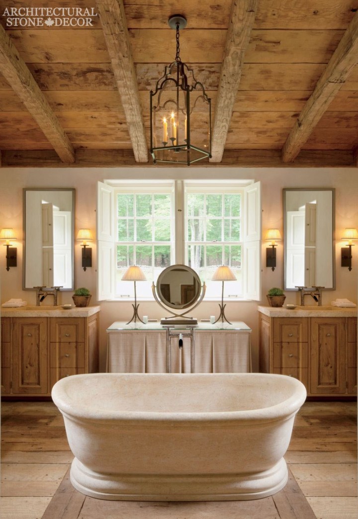 French country bathroom reclaimed hand-carved limestone bath tub wood ceiling