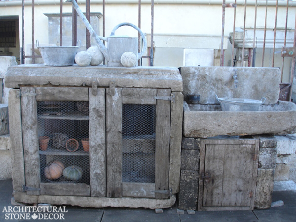 Outdoor kitchen with reclaimed limestone sink