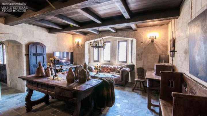 Medieval game of thrones dungeon doors reclaimed limestone wall cladding rustic wood beams and furniture