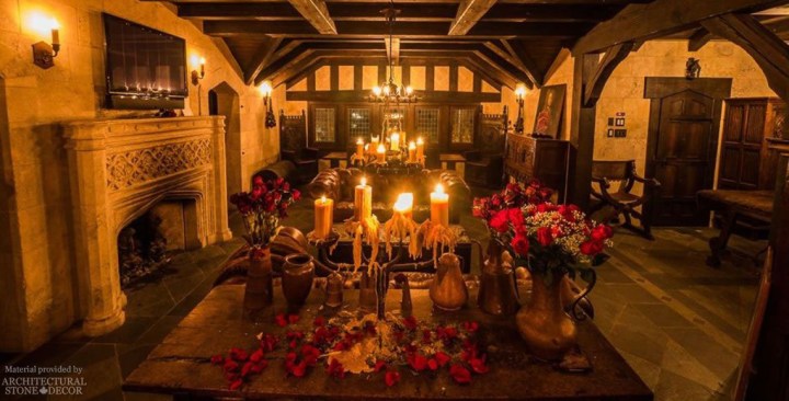 Game of thrones medieval gothic living room hand carved reclaimed firepalce mantel wall cladding rustic wood beams