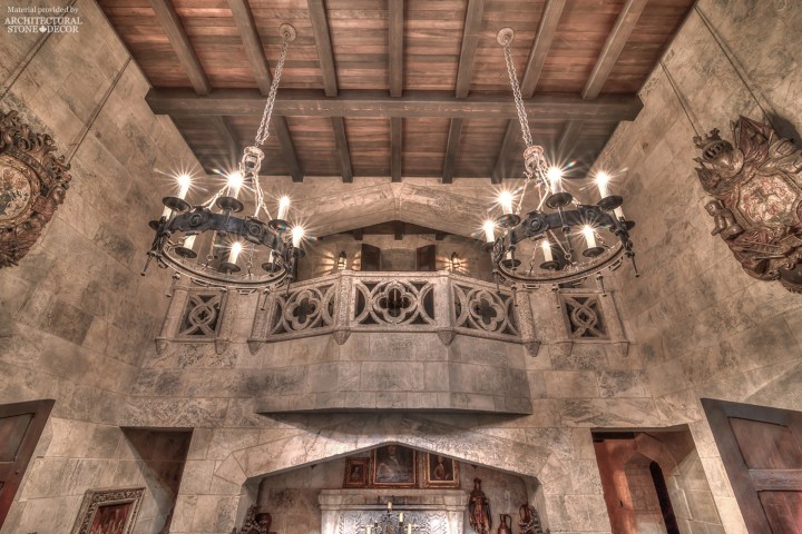 Game of Thrones Gothic Medieval style castle with reclaimed limestone wall cladding, roman arches, balcony balustradesdes, wood ceiling, iron chandeliers