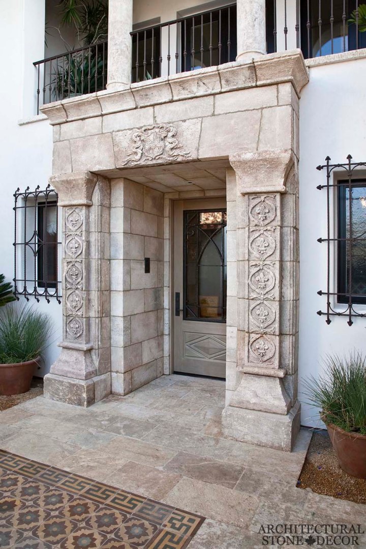 Game of Thrones Medieval Gothic hand carved reclaimed limestone entryway and reclaimed 'Barre Montpelier' limestone flooring colored french tiles