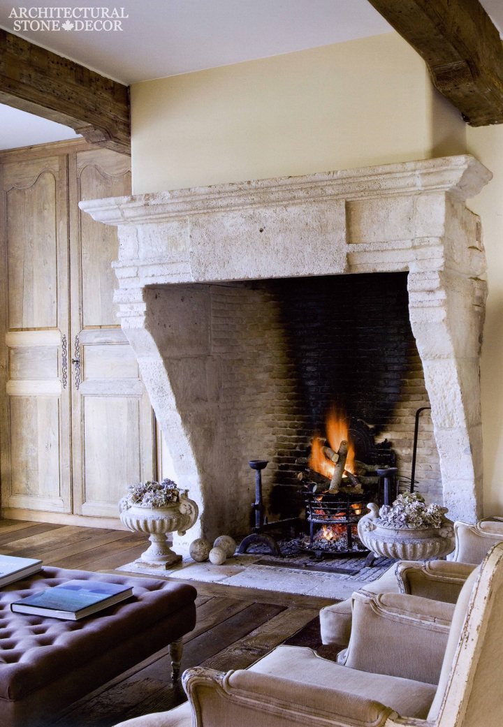 Medieval Gothic Game of Thrones interior style reclaimed ancient rustic hand carved limestone fireplace mantel brick firebox