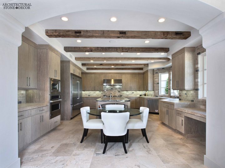 neolithic modern old world Barre Blonde reclaimed salvaged antique limestone flooring tiles running bond exposed ceiling wood beams butcher block counter tops modern kitchen canada Toronto Vancouver