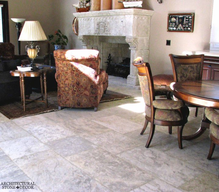 old world Barre Blonde reclaimed salvaged antique limestone flooring tiles running bond exposed ceiling wood beams modern living room hand carved reclaimed fireplace mantel canada toronto