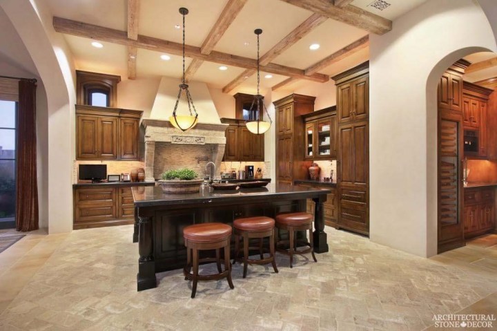 Canada Vancouver Mediterranean style hand carved salvaged natural stone kitchen hood Herring bone installation reclaimed French limestone Dalle de Bourgogne flooring