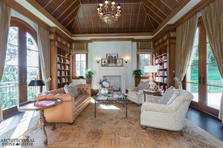 rustic style living room reclaimed antique salvaged hand carved limestone natural stone fireplace mantel wood ceiling canada UK Australia