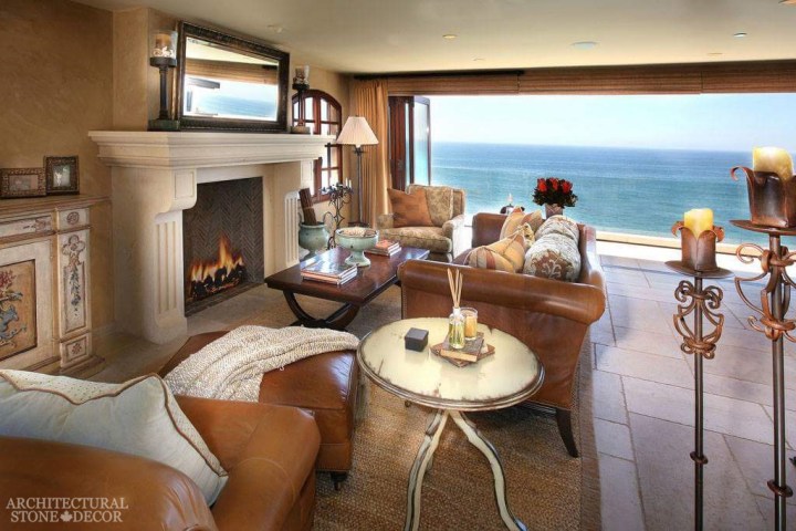 newy carved limestone natural stone hand carved fireplace mantel canada living room decor Barre Blonde flooring beach house