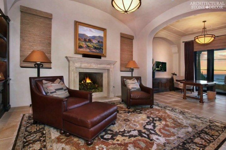 salvaged reclaimed rustic antique limestone natural stone hand carved fireplace mantel canada living room decor