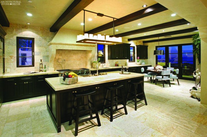 Mediterranean Kitchen reclaimed limestone Barre blonde flooring Barre Montpelier wall cladding backsplash butcher block counter tops hand carved kitchen hood Canada
