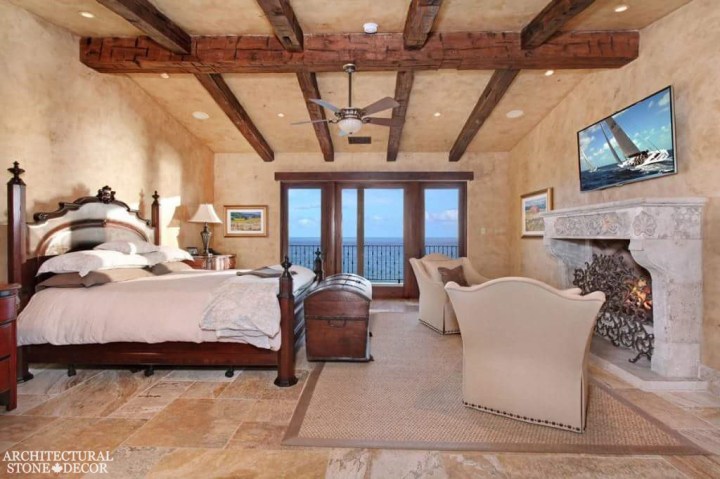 salvaged reclaimed rustic antique limestone natural stone hand carved fireplace mantel canada bedroom decor