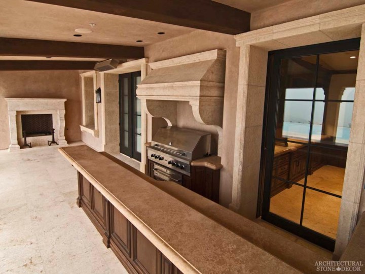Rustic natural stone outdoor kitchen hood butcher block counter tops reclaimed limestone entryway window sills hand carved fireplace mantel Barre Blonde flooring Canada