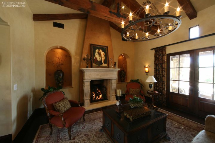 Tudorian Gothic living room reclaimed antique salvaged hand carved limestone natural stone fireplace mantel canada UK Australia