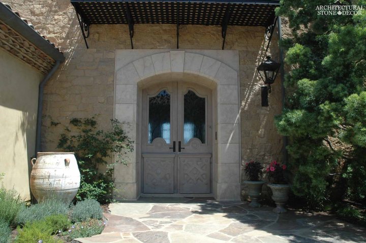 Coastal Mediterranean style hand carved limestone entryway Ontario Canada Vancouver British columbia Alberta Toronto home design