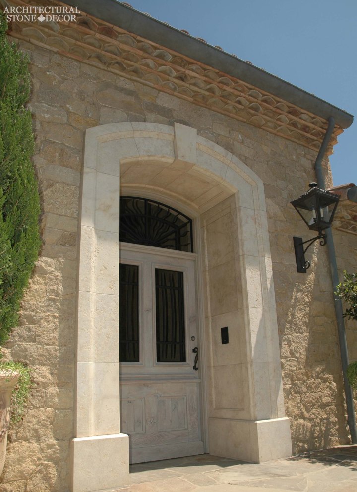 Coastal Mediterranean style hand carved limestone entryway Ontario Canada Vancouver British columbia Ottawa home design