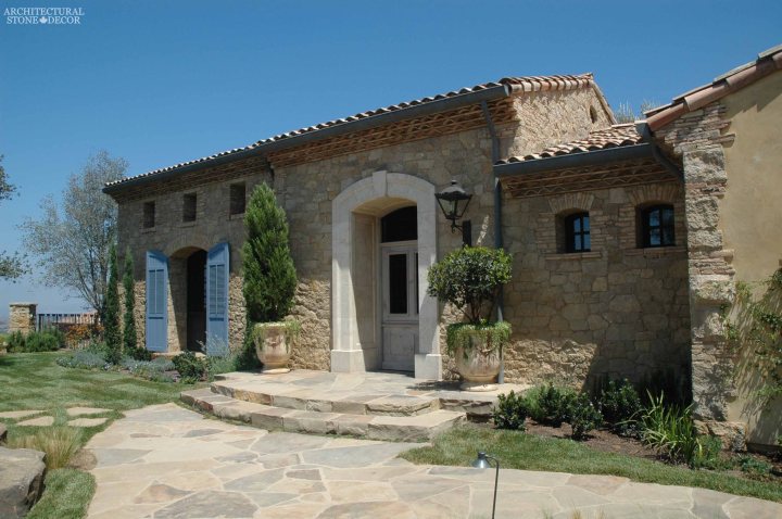 Coastal Mediterranean style hand carved limestone entryway Ontario Canada Vancouver British columbia Toronto home design
