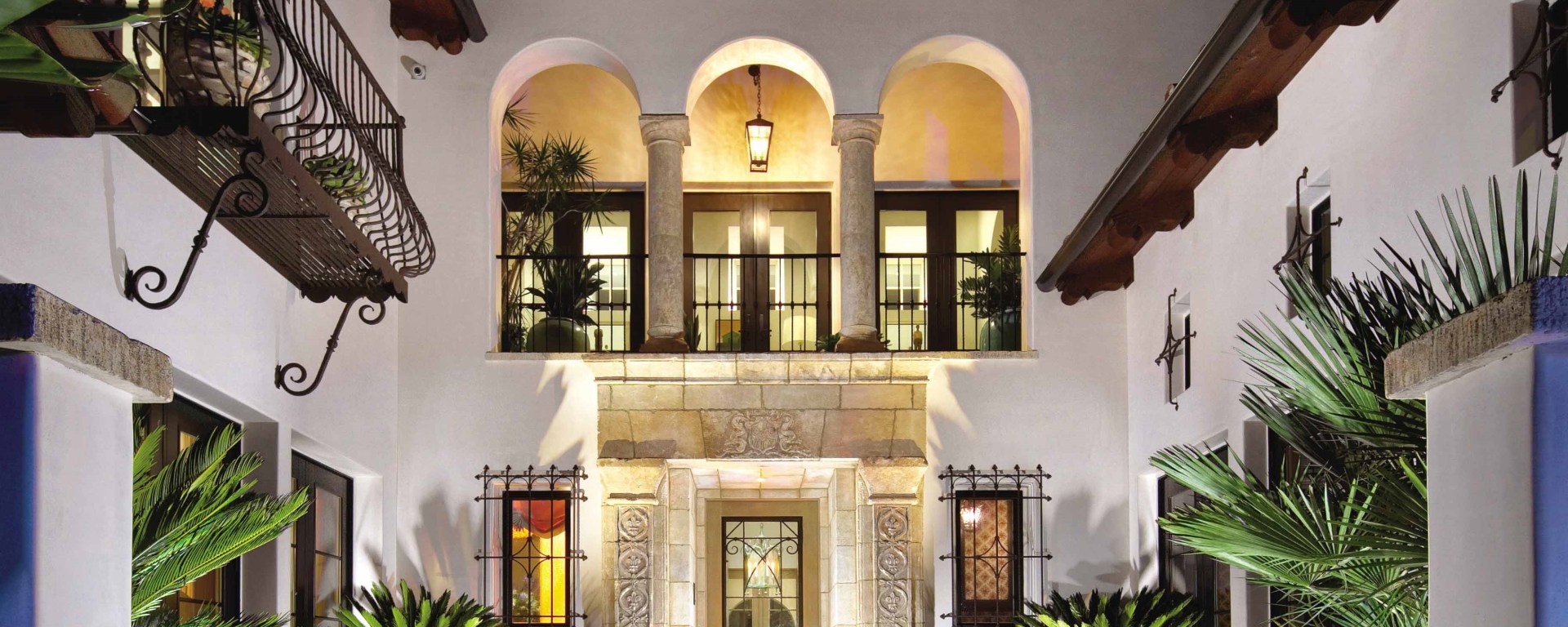 Tuscan Mediterranean style villa antique limestone entryway French stone Dalle de Bourgogne flooring Barre Montpelier wall cladding reclaimed colored cement pavers Ontario Toronto