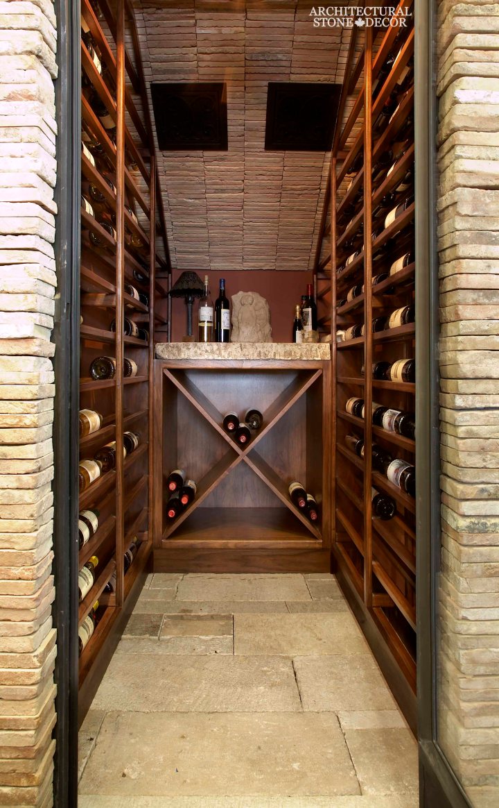 Antique Rustic Old world wine cellar salvaged reclaimed limestone ceiling and flooring entryway wood wine racks natural stone butcher block countertop