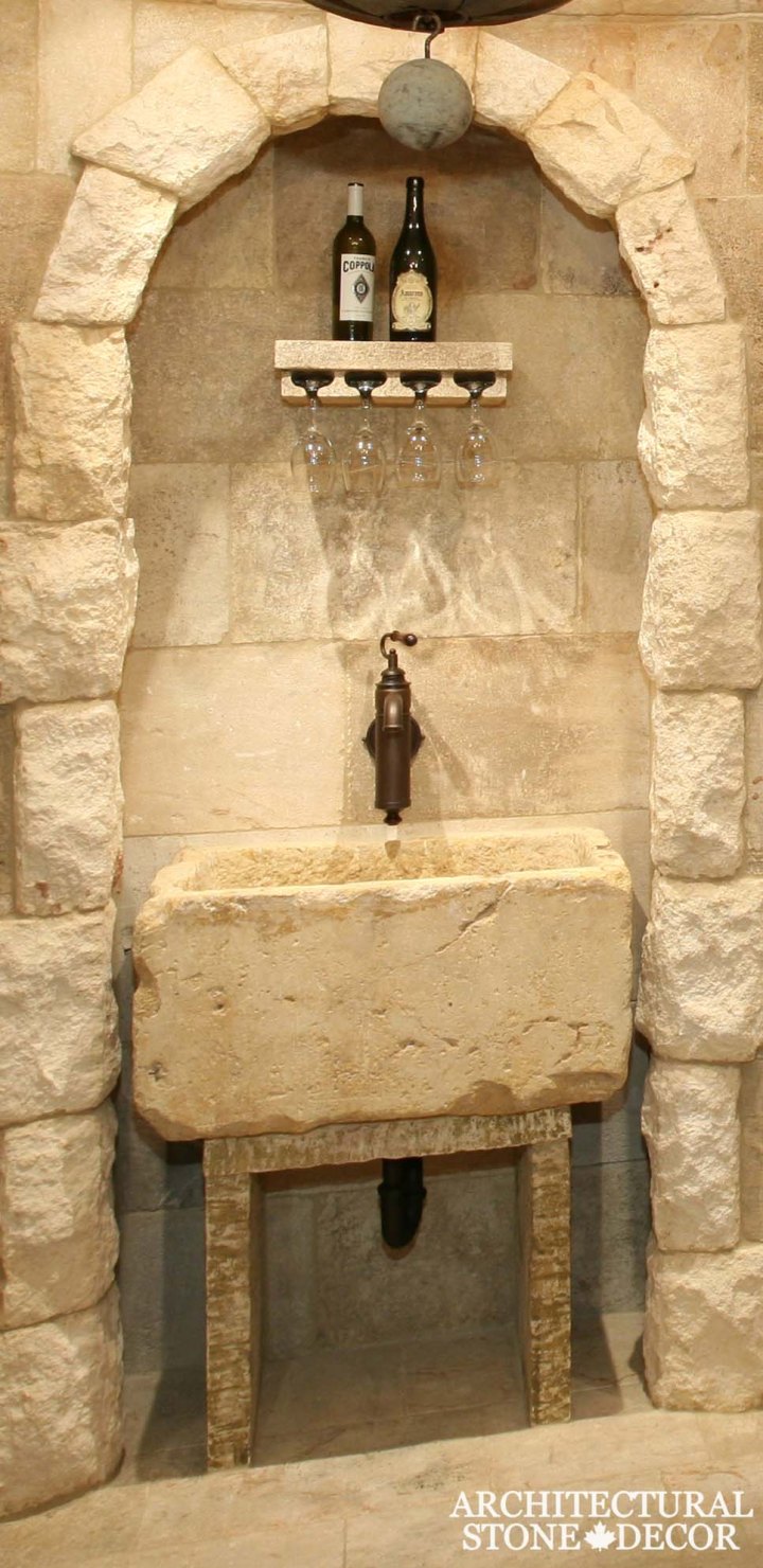 Rustic reclaimed salvaged hand carved natural stone limestone wall cladding arch flooring wine glass holder shelf table trough toronto canada