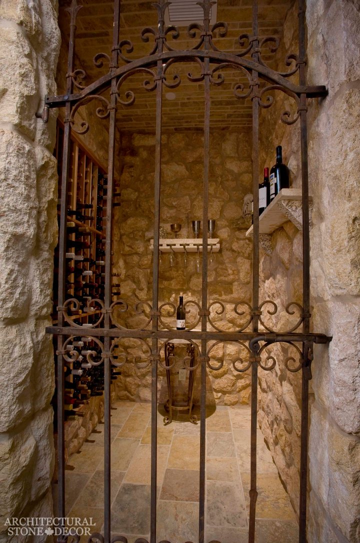 Rustic reclaimed salvaged old natural stone hand carved limestone flooring wall cladding ceiling table shelf wine glass holders wrought iron gate