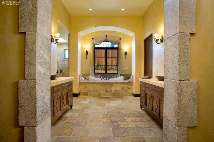 Tuscan style bathroom rustic old reclaimed natural stone limestone flooring corners countertops