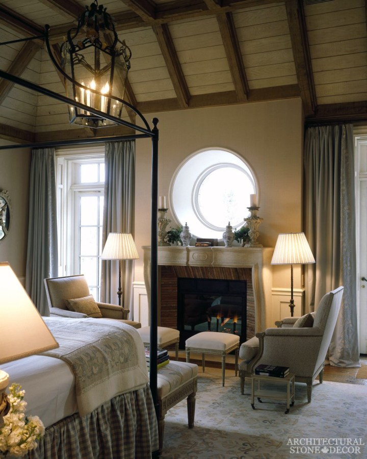 French country style master bedroom natural reclaimed antiqued limestone stone fireplace mantel canada ca