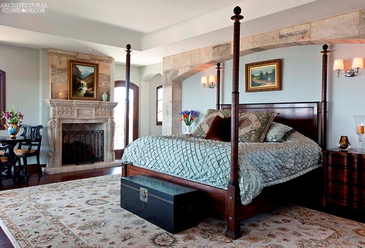 French Mediterranean style master bedroom reclaimed antiqued rustic natural stone limestone fireplace mantel wall cladding canada ca