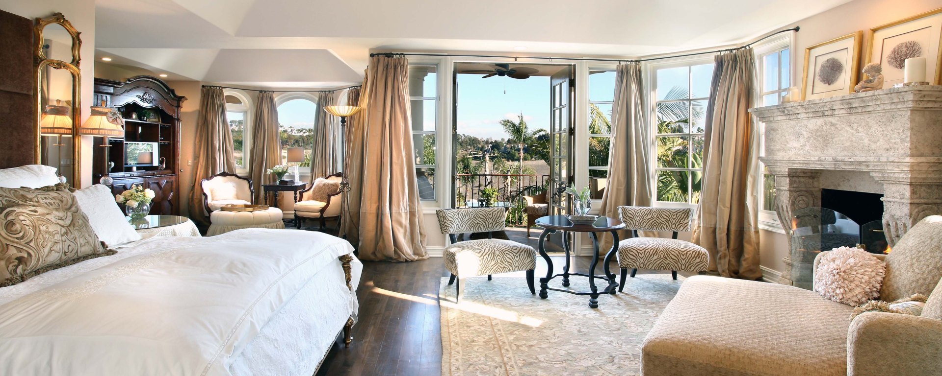 west coast style coastal mediterranean master bedroom limestone handcarved reclaimed antiqued fireplace mantel cladding Canada