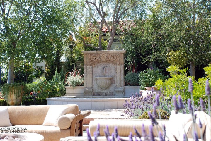 Rustic reclaimed old hand carved Tuscan Italian Mediterranean limestone natural stone wall fountain ca canada UK USA Singapore Qatar