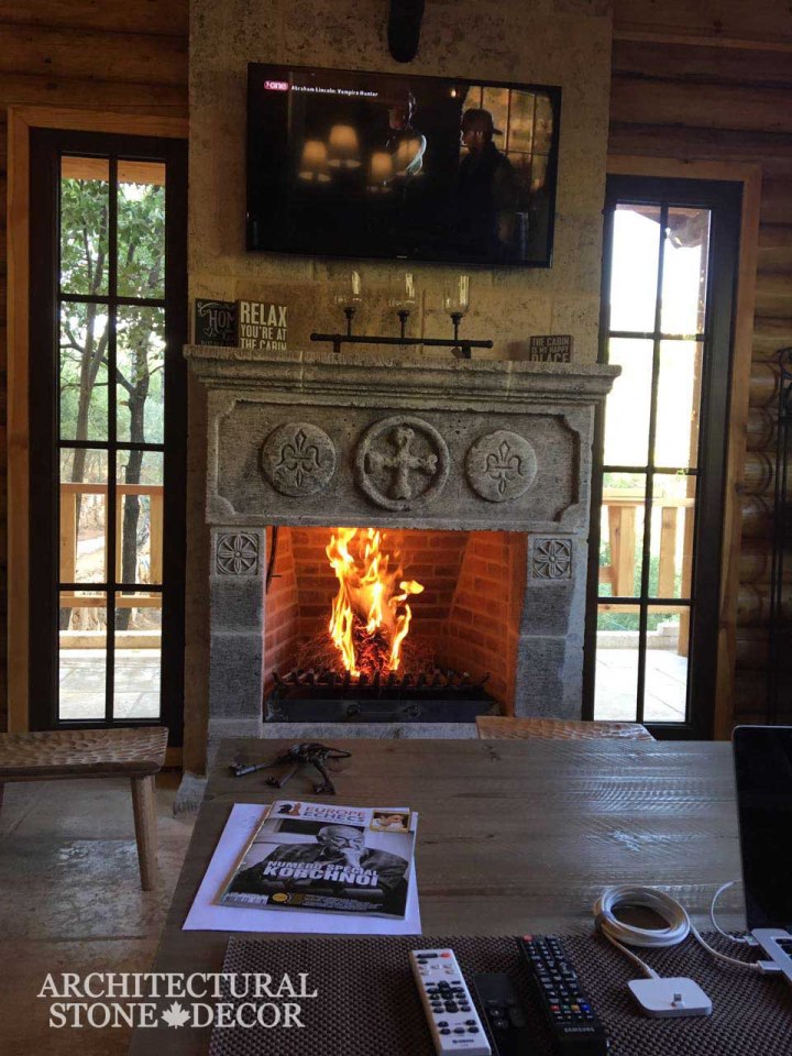 Hand carved reclaimed antiqued hunting lodge cabin interior design natural stone limestone fireplace mantel home decor Canada CA UK USA BC