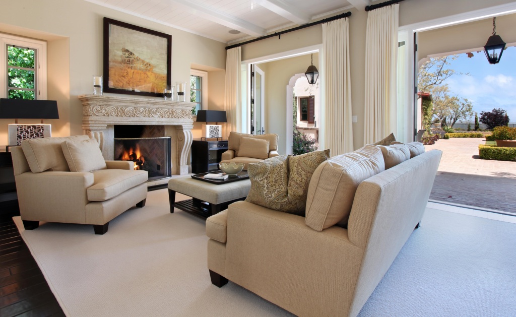 Reclaimed Italian stone fireplace mantel interior design Tuscan living room corbel legs