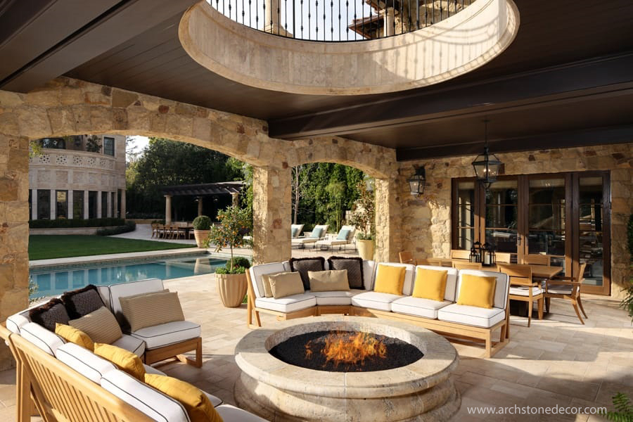 Tuscan style patio hand carved limestone fire pit interior design landscape with Barre Montpelier flooring tiles